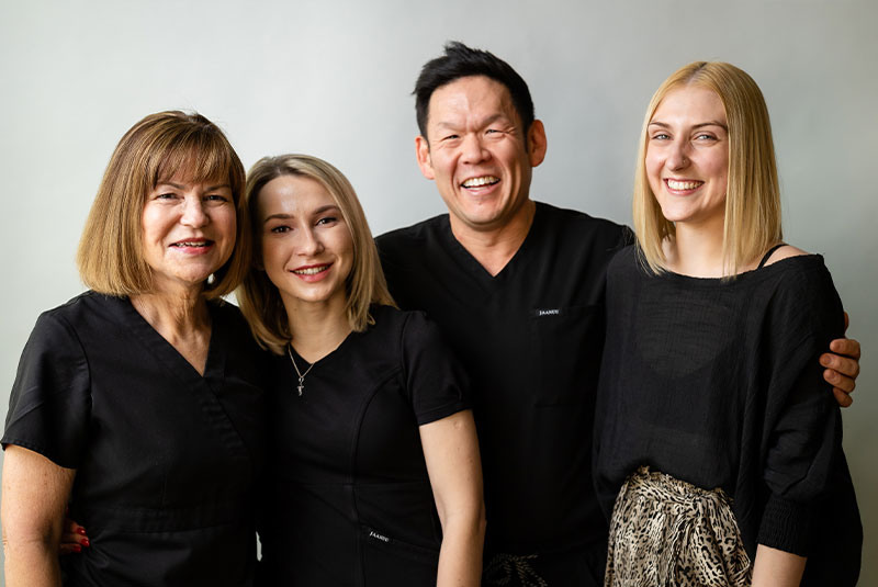 group picture of staff members and doctors within the dental center